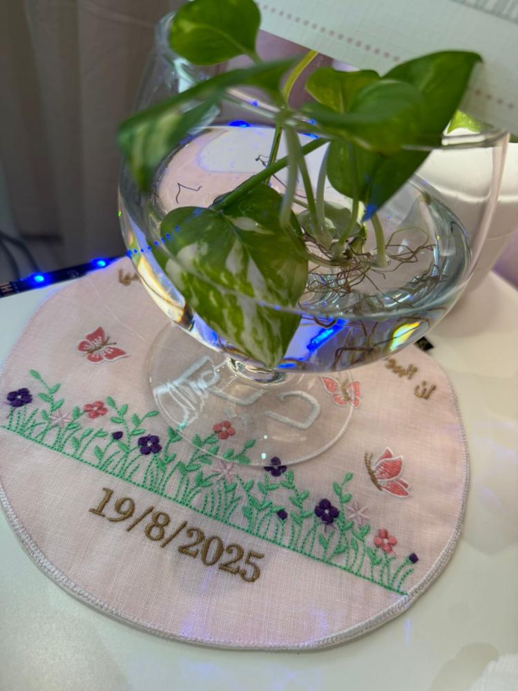 A frame with a stand for welcoming a newborn, with a small bedspread size 22 diameter