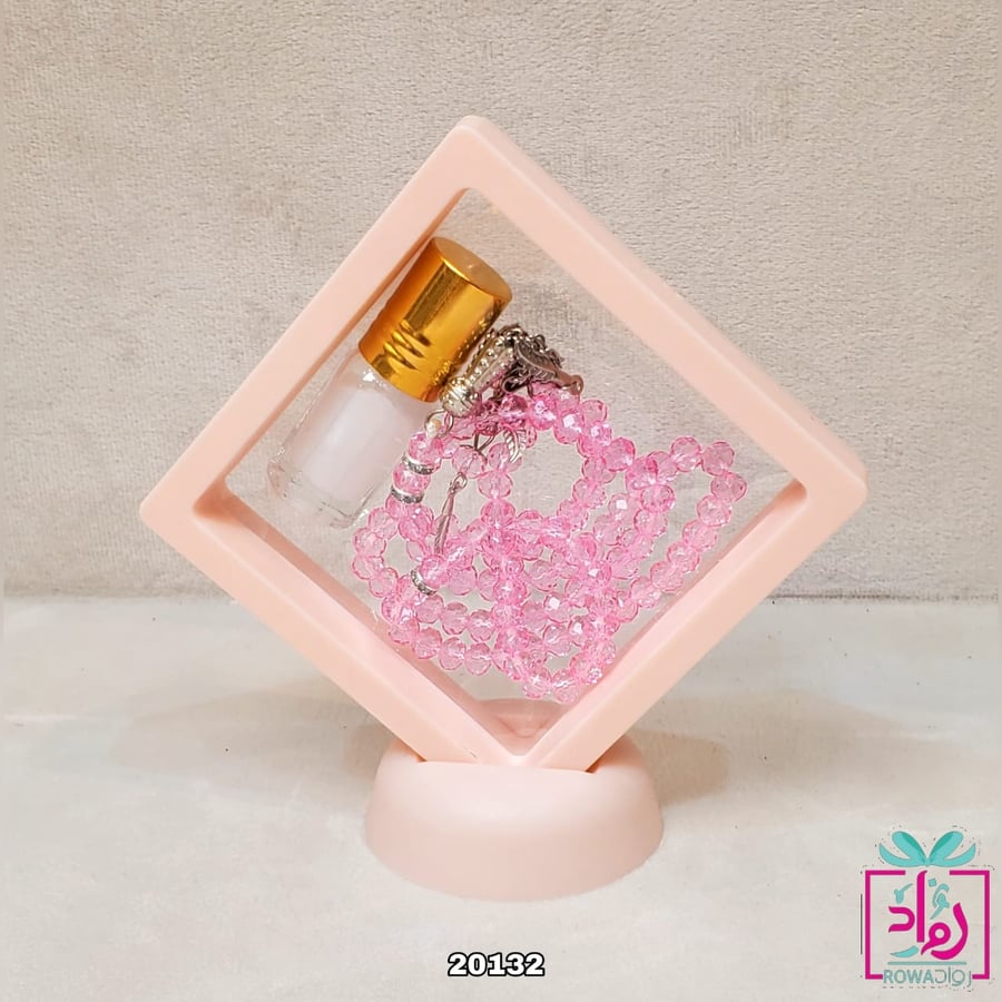 توزيعات(12) مسبحة وردي مع تولة عطر داخل اطار وردي شفاف