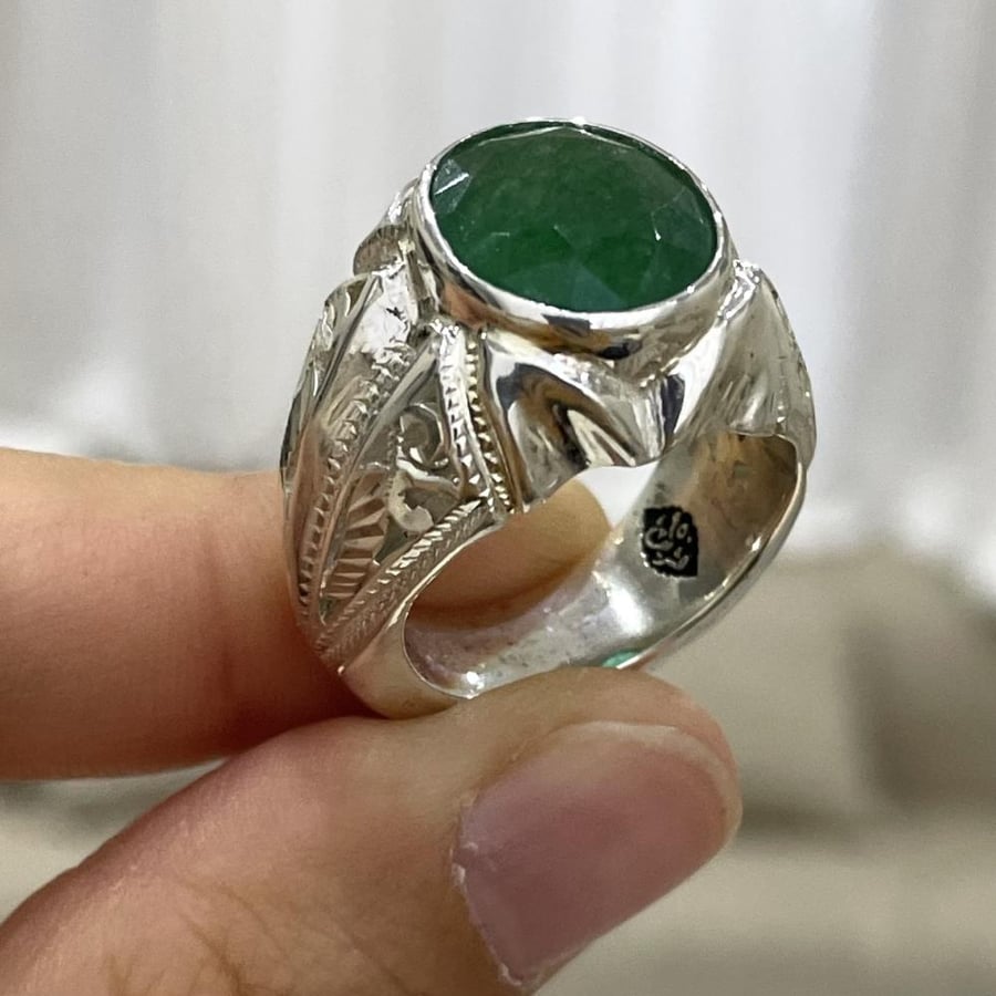Men's silver ring with an emerald stone