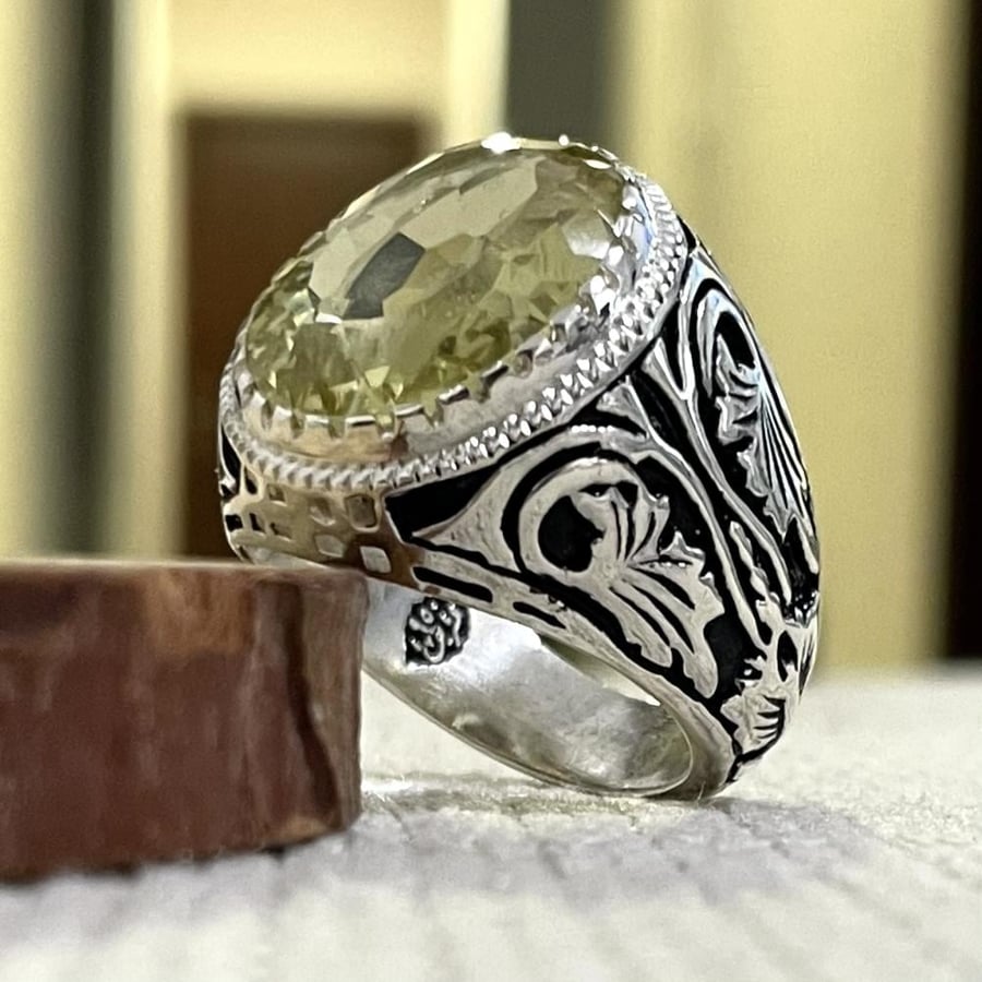 Men's silver ring with a sapphire stone