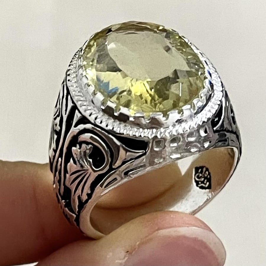 Men's silver ring with a sapphire stone