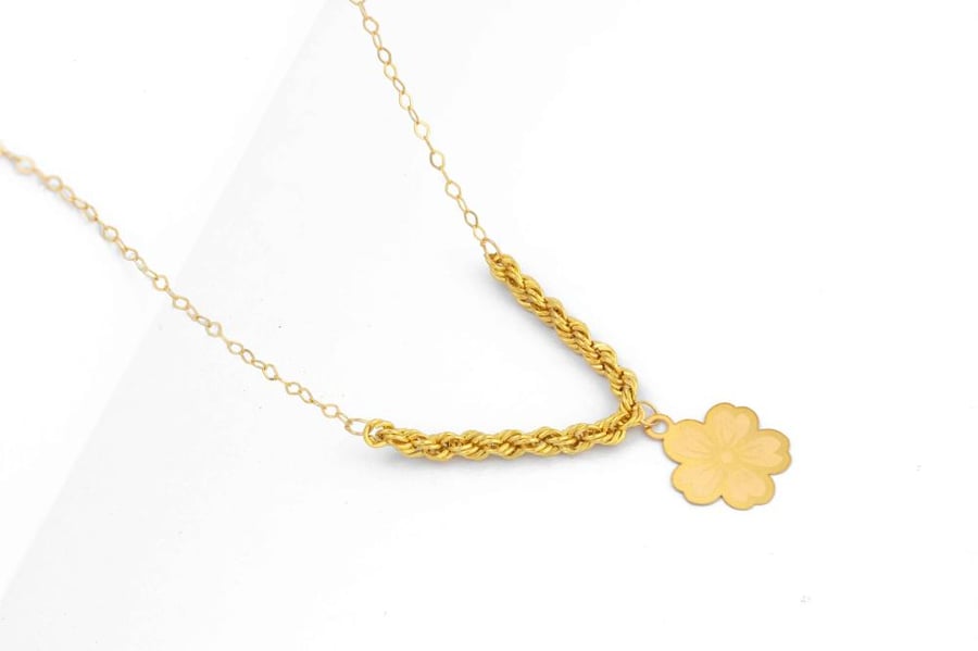 Beautiful and smooth 21-karat gold necklace featuring a five-petaled open rose