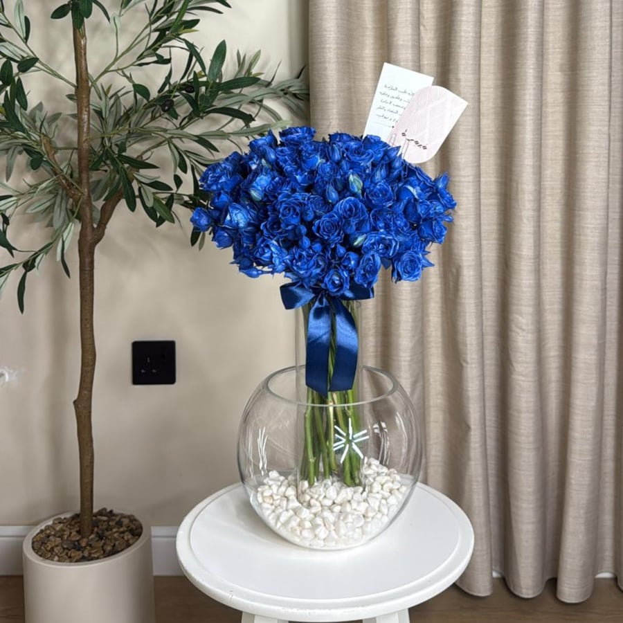 Two vases with blue roses