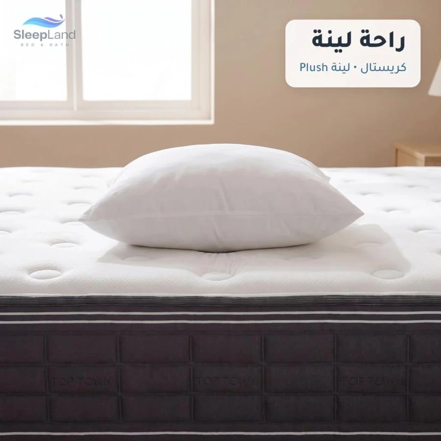 مخدة بيضاء على سطح مرتبة كريستال اللينة بانغماس خفيف
