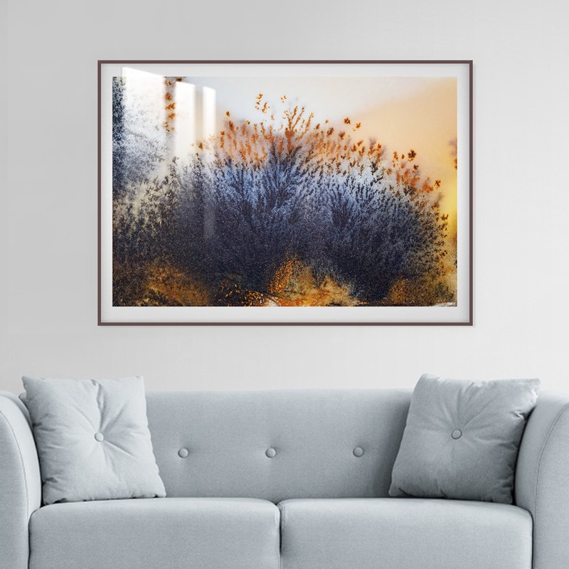 Wall art with abstract art design, frame, and a layer of acrylic