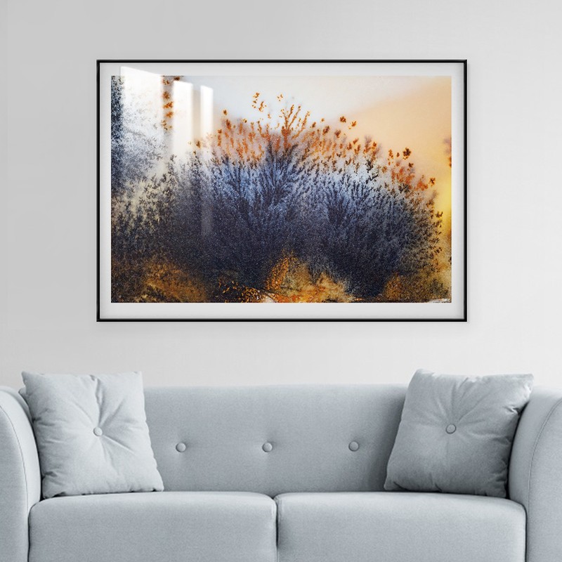 Wall art with abstract art design, frame, and a layer of acrylic