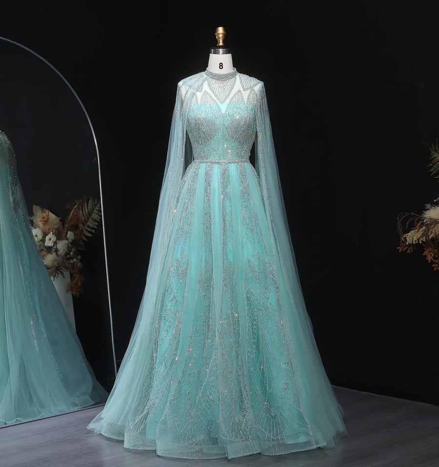 Royal evening gown with cape sleeves and luxurious crystal embroidery