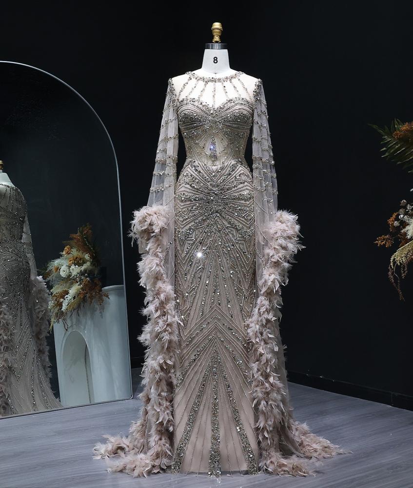 Luxury evening dress embroidered with delicate details of elegant feathers