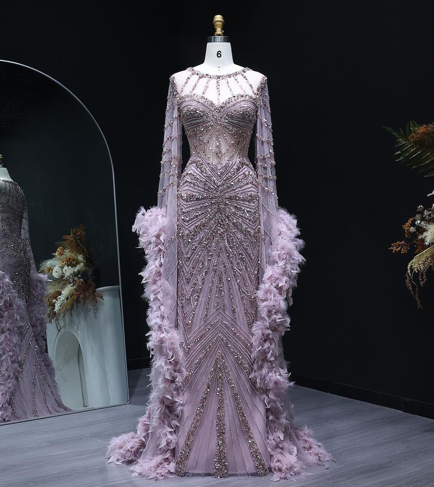 Luxury evening dress embroidered with delicate details of elegant feathers