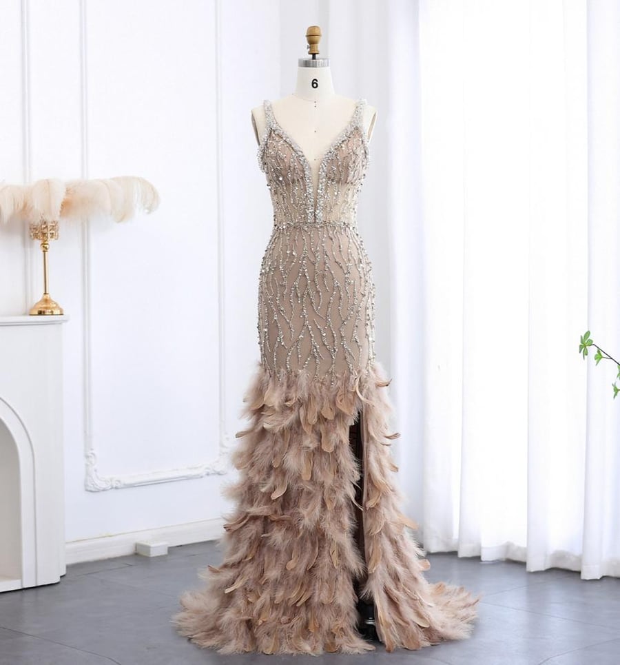Luxury mermaid evening dress with side slit and decorated with feathers and crystal