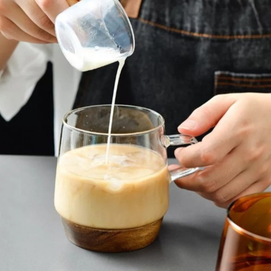 Glass cup with wooden base