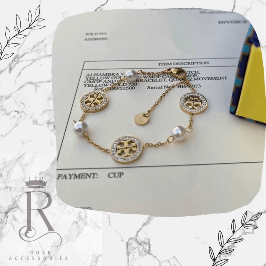 Tory Burch gold bracelet with pearl