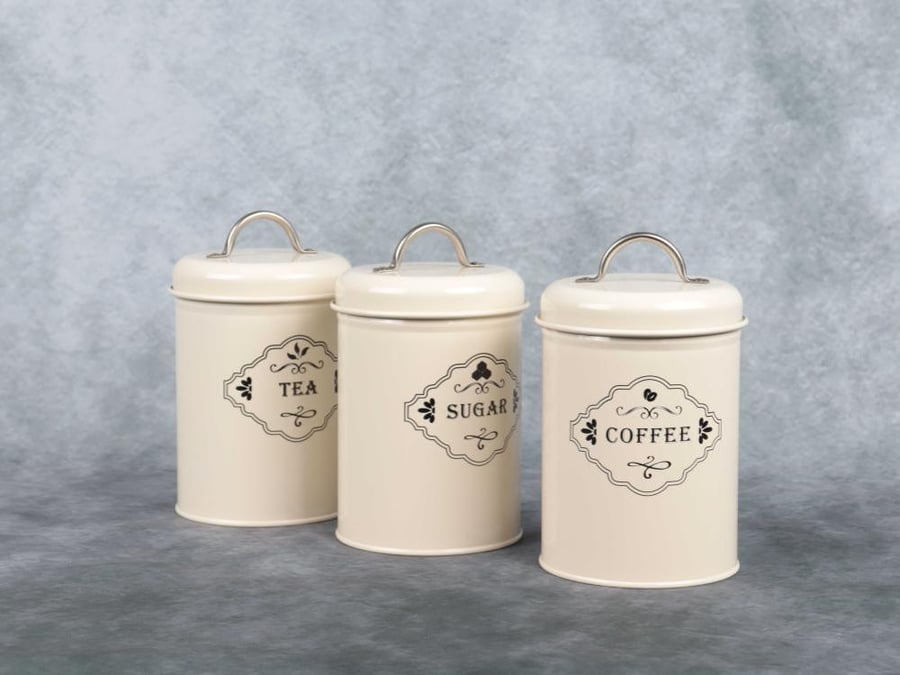 A set of sugar, tea, and coffee containers in beige color