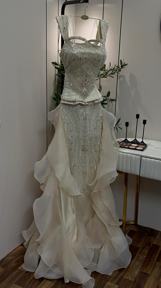 Evening dress, material crinkle and beads, beige color, long, dress tail, light.