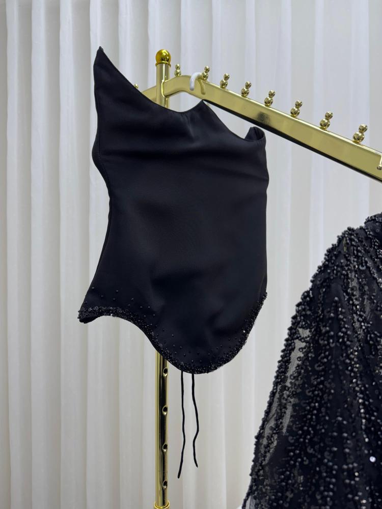 A long black fabric dress with chiffon, Barbie style, with embroidery.