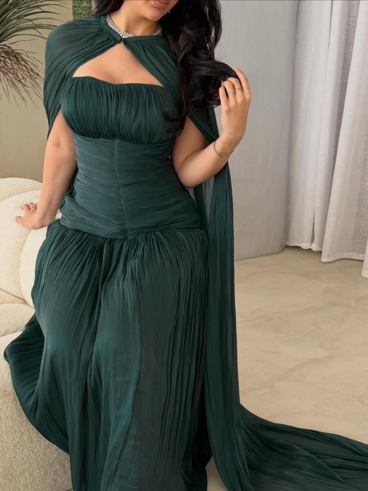 An olive-colored dress. Long crinkle fabric. An impressive dress.