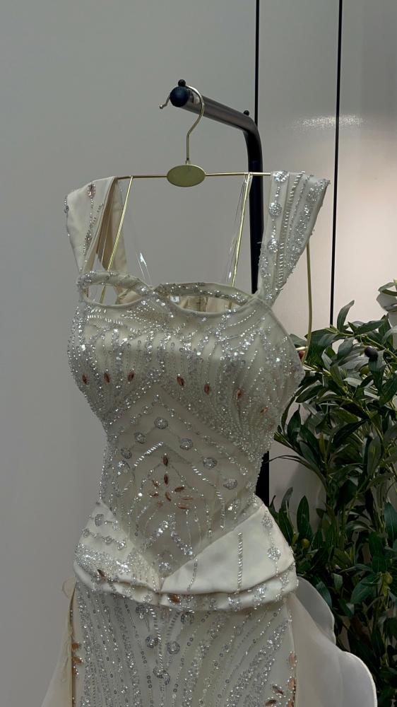 Evening dress, material crinkle and beads, beige color, long, dress tail, light.