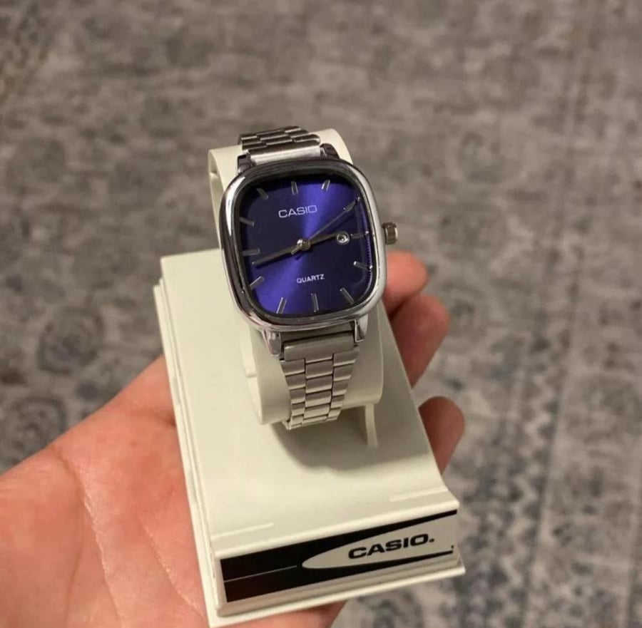 Women's silver Casio with blue display