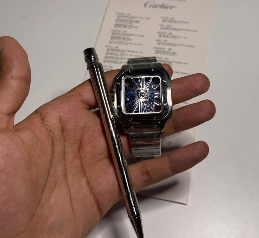 Cartier watch set, open, and Cartier pen
