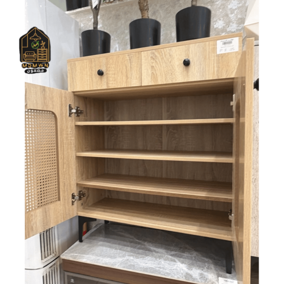 A wardrobe with a modern design, featuring rattan details and practical doors.
