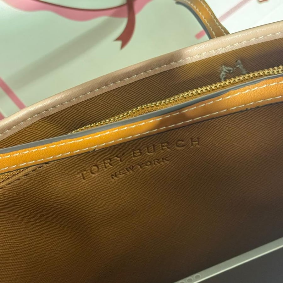Colorful Tory Burch bag with the medal