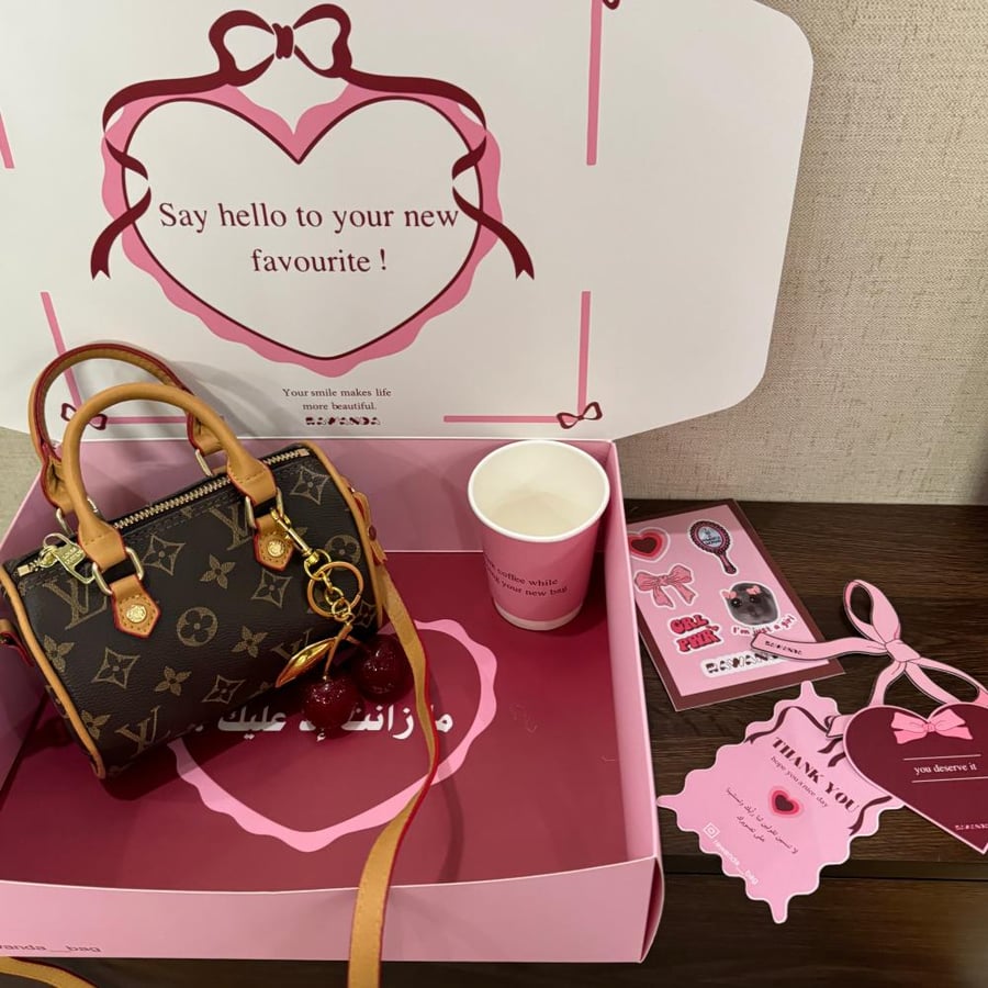 Louis Vuitton Nano Speedy bag with accessories and cherry medal