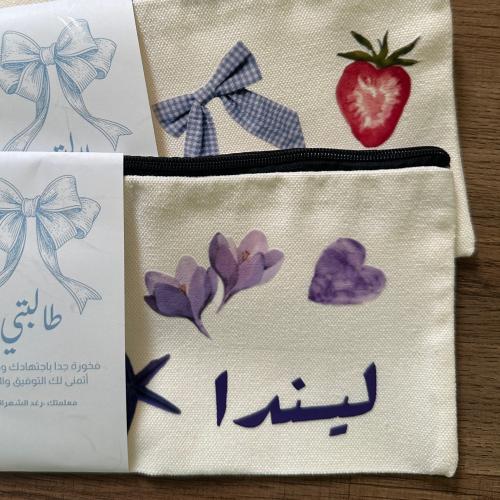 محفظه قماشيه بالاسم مع امكانية اضافه صور حسب الطلب