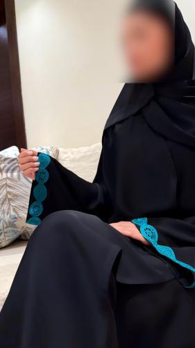 A line with Turquoise Tricot and Wide Sleeves