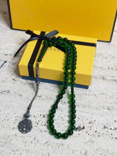 سبحة اخضر غامق بكلايت مع طربزونه فضة.