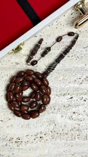 سبحة من خشب الثعبان نحت يدوي من افضل الفنانين  مطرزه فضة