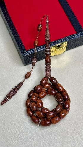 سبحة من خشب الثعبان نحت يدوي من افضل الفنانين  مطرزه فضة