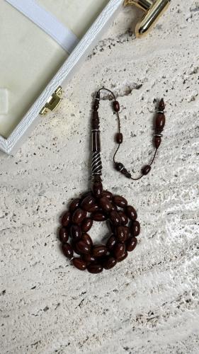 سبحة من خشب الثعبان نحت يدوي من افضل الفنانين  مطرزه فضة