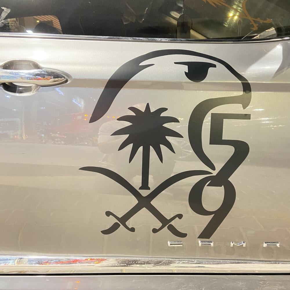 شعار الصقر 95 مع سيفين ونخلة جهتين