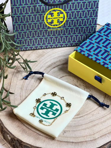 إسوارة TORY BURCH معدن ذهبي بفصوص