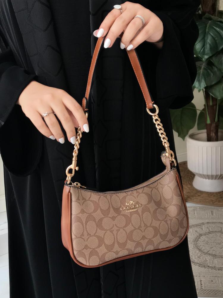 حقيبة كوتش مستر الأنيقة بلون بني- تصميم فاخر وأناقة لا مثيل لها