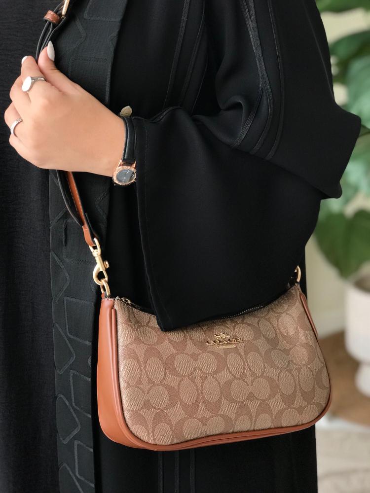 حقيبة كوتش مستر الأنيقة بلون بني- تصميم فاخر وأناقة لا مثيل لها