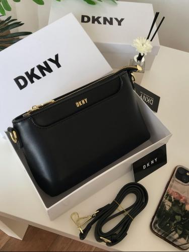 حقيبة DKNY السوداء السادة: رمز الأناقة والتميز!"