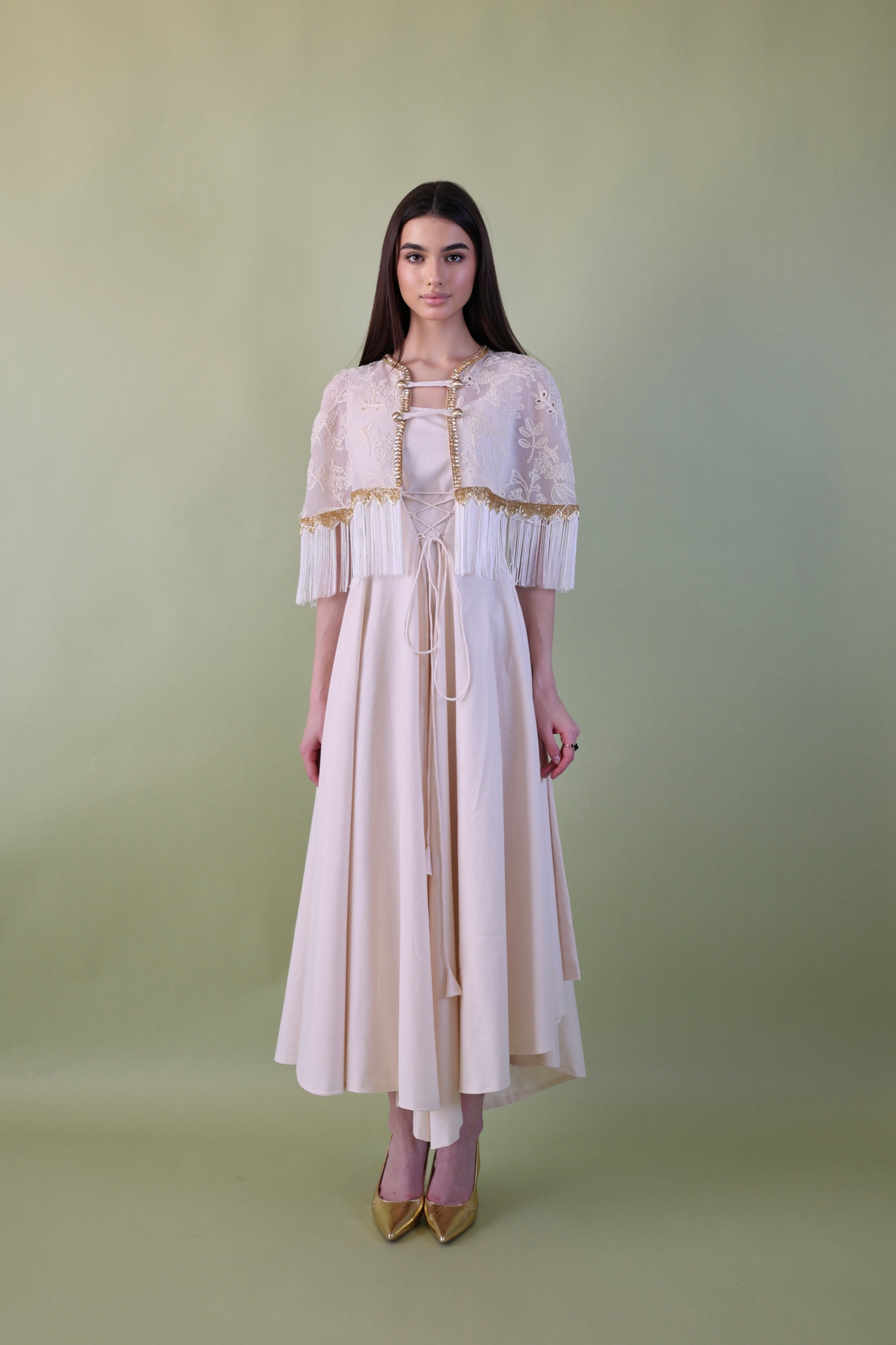 a dress with a distinctive Design made of two pieces, a dress with a special piece equipped with luxurious and elegant details on the shoulders in the