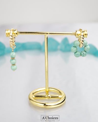 اقراط ذهبية مزينة باحجار كريمة بتصميم معاصر