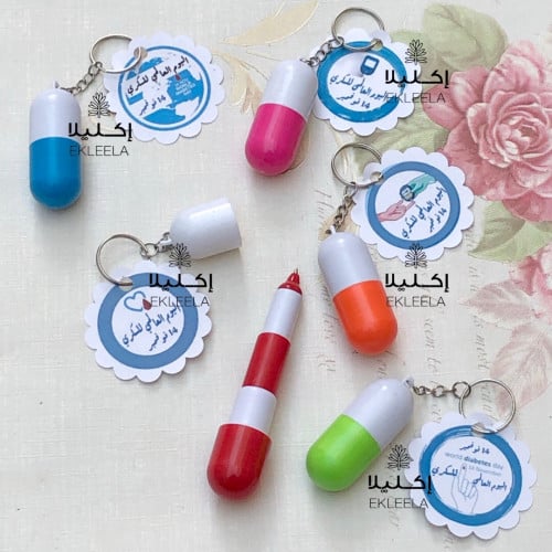 توزيعات اقلام على شكل كبسولة دواء مع ثيم ورقي ( 12 قطعه )