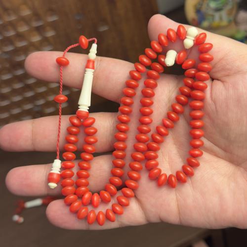 مسباح برتقالي مطعّم بعظم