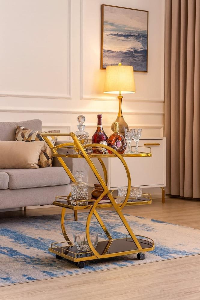 عربة تقديم فاخرة بثلاثة أدوار – أناقة الزجاج الأسود ولمعان الاستيل الذهبي