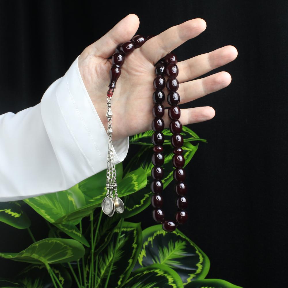 مسباح مسكي كرزي غامق – خرز بيضوي وكركوشة معدنية