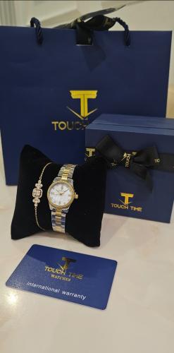 ساعة نسائي ماركة TOUOH TIME مع أساور مطلية ضد الماء ضمان سنة مع بوكس وكيس الماركة