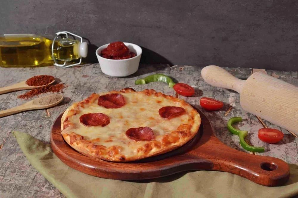 الفرق بين بيتزا الفرن وبيتزا القلاية الهوائية