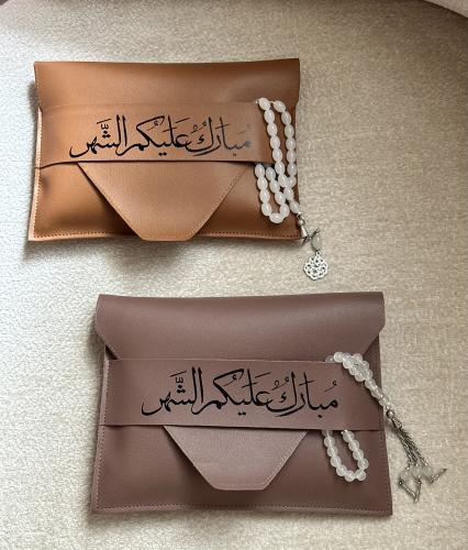 توزيعات رمضان شنطة جلد