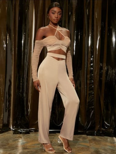 طقم لباس علوي مشقوق الظهر مع بنطلون لون مشمشي