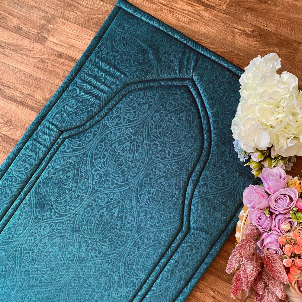 سجادة صلاة بلون تركواز