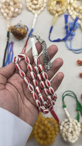 عظم جمل مطعم بنحاس وتراب مرجان ٣٣ خرزه ٩