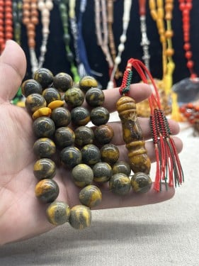 كهرمان قديم شوائب ٣٣ خرزه ١٥ مل ٦٥ جرام